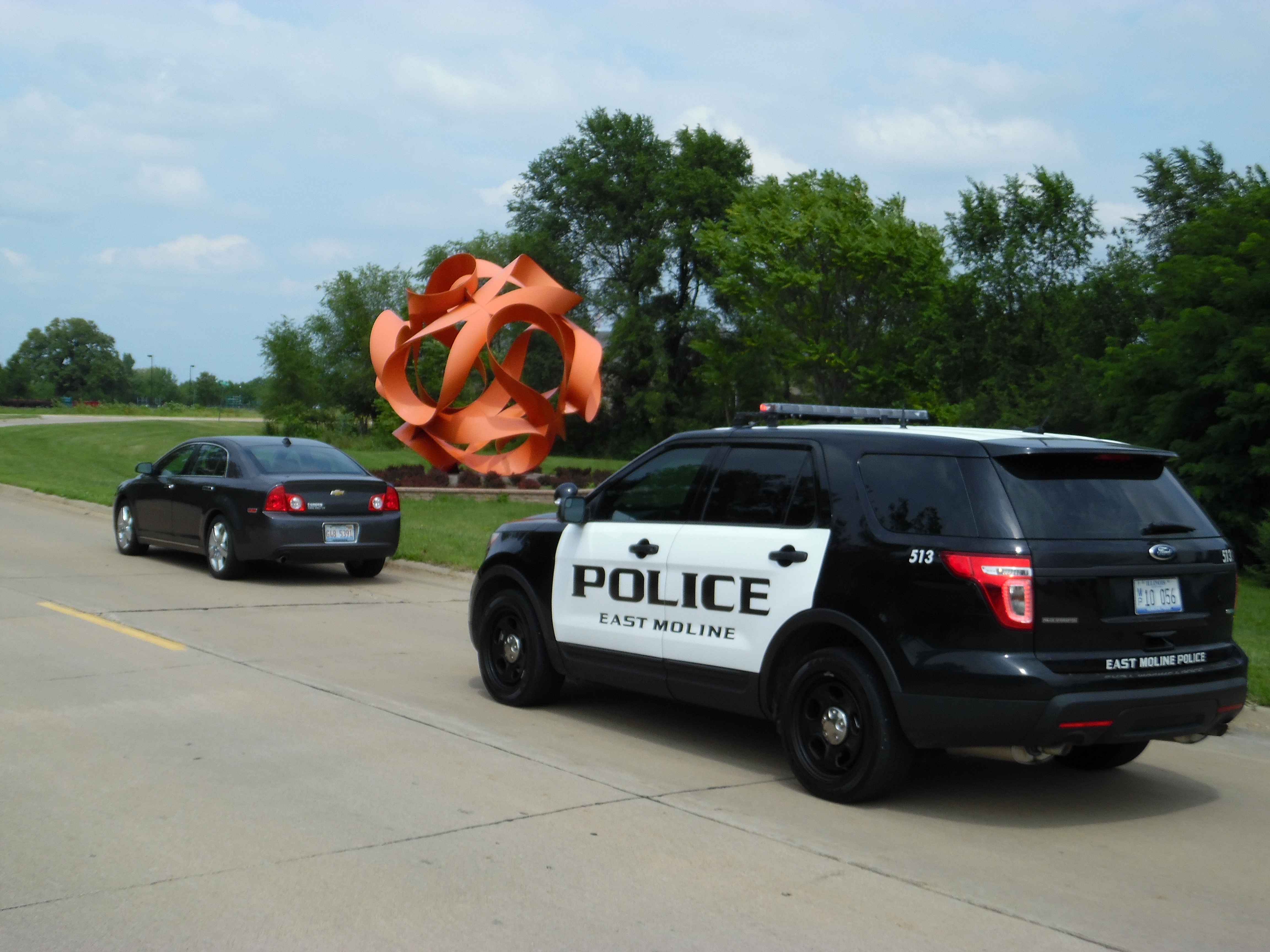 Police Vehicle Parked Behind a Car